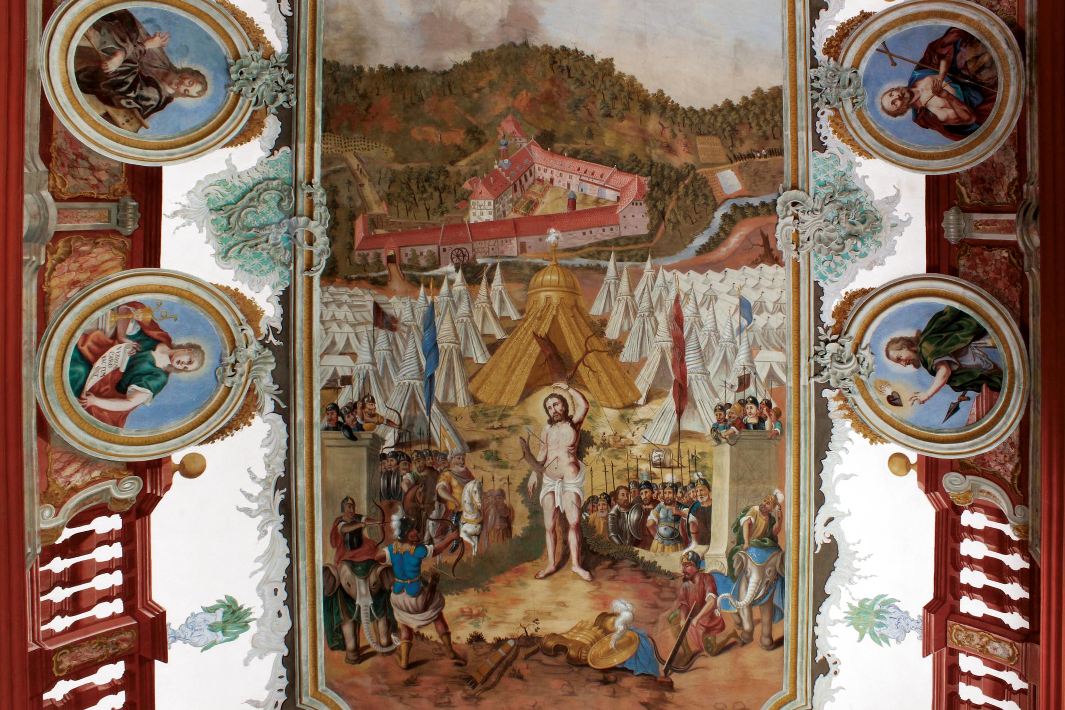 Das um 1780 entstandene Deckengemälde in der Kirche zeigt im Hintergrund den barocken Klosterkomplex. Foto und Bearbeitung: Burglandschaft